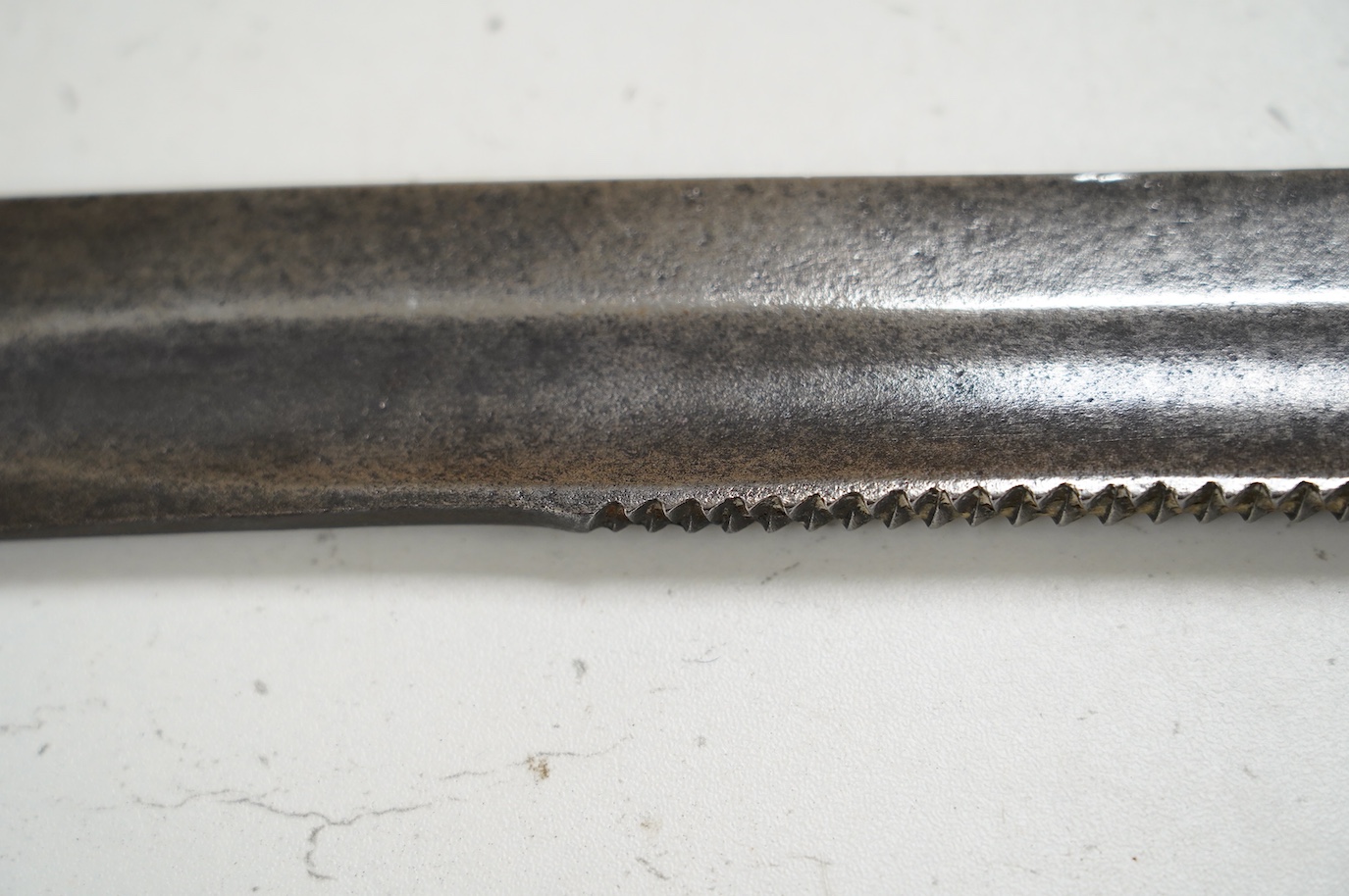 An 1847 Russian pioneer short sword, based on the French 1831 Gladius, with saw back edge, blade 48cm. Condition - good